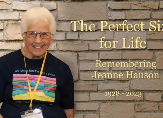 A photo of Jeanne Hanson at the 2014 gathering. The words say "The Perfect Size for Life: Remembering Jeanne Hanson, 1928-2023.
