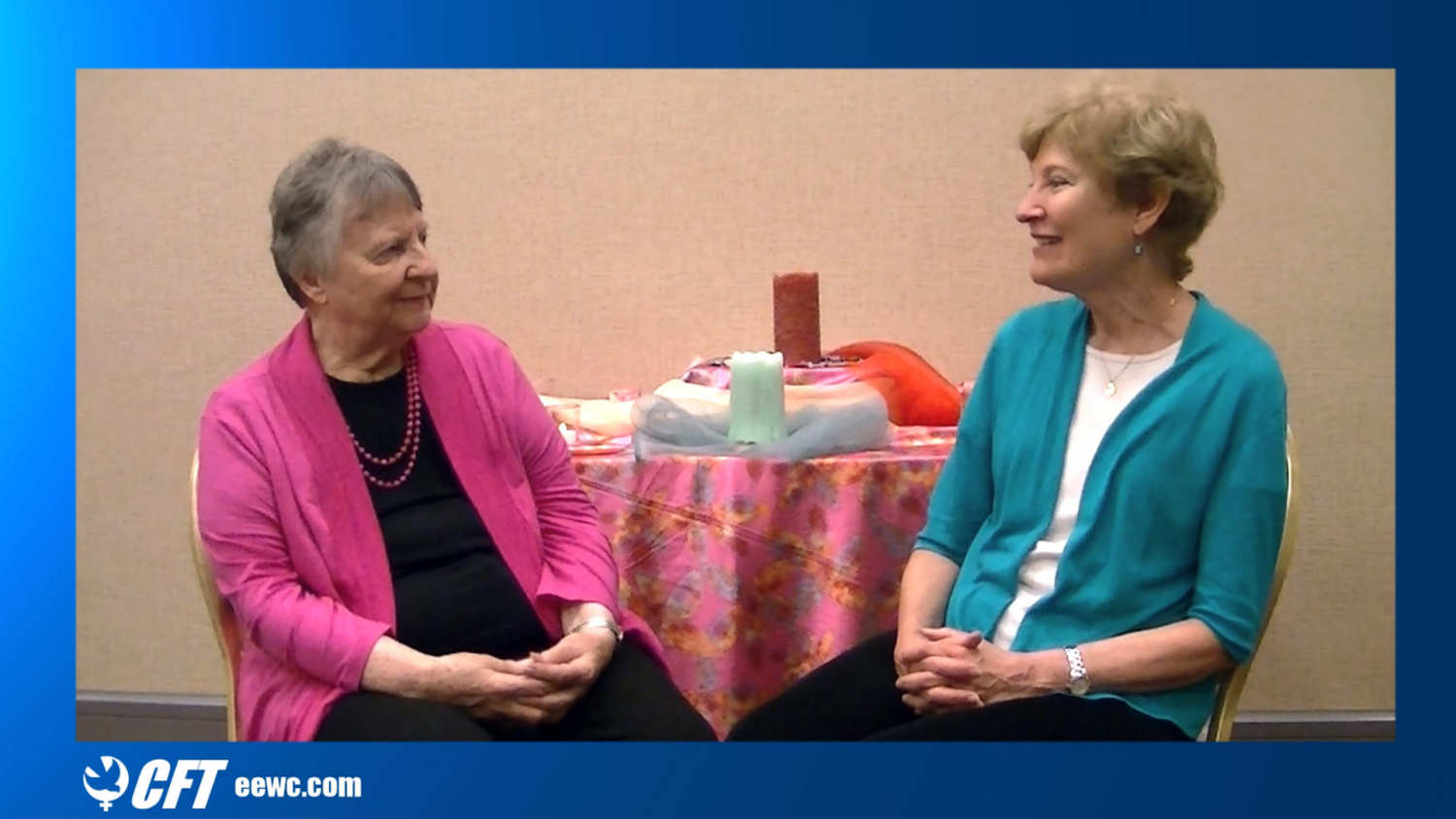A screenshot from a video recording showing Letha Dawson Scanzoni and Jann Aldredge-Clanton with a small altar behind them.